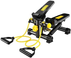 Mini stepper com pedais antiderrapantes e duas cordas elásticas extensoras pretas presas à base.